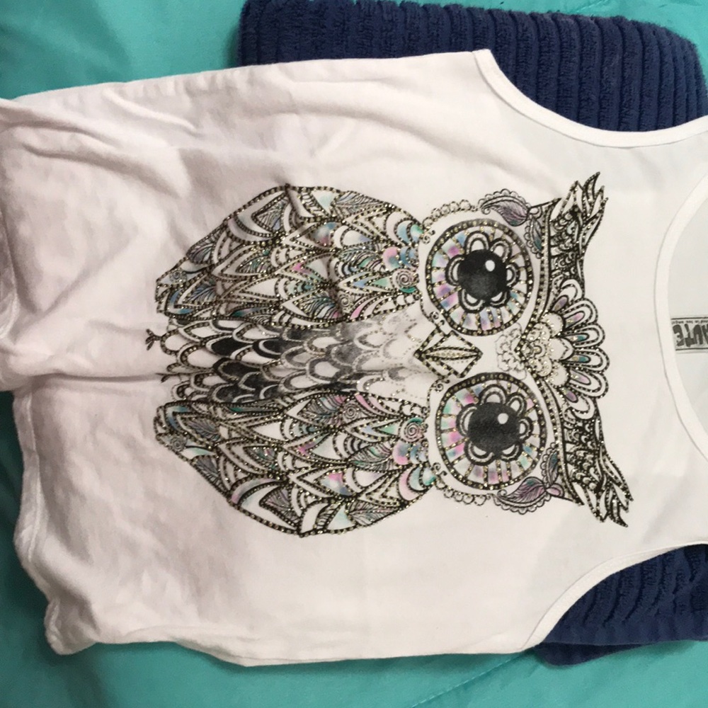 A white tantop with a cute owl
